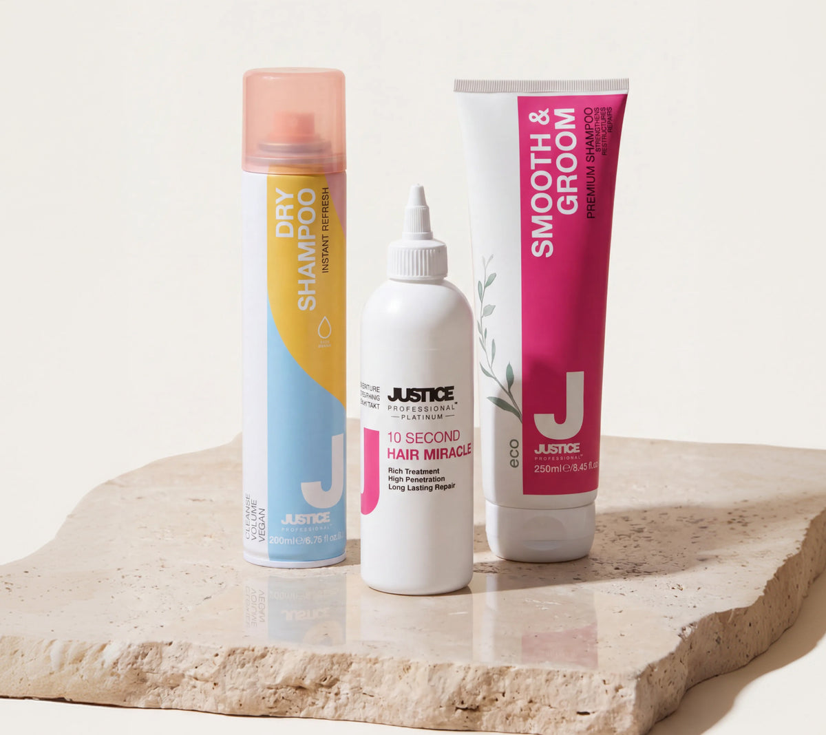 Justice Dry Shampoo, 10 Second Hair Miracle and Smooth & Groom Shampoo on a stone plinth